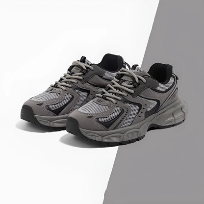 Grey platform casual sneaker with PU mesh upper, leather stitching, and a flat EVA sole.