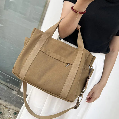 Army Green canvas tote bag showing open top with internal laptop pocket and organisers.
