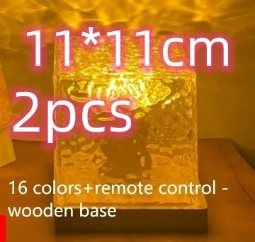 LED water ripple projection night light with remote control on wooden base showing colourful light patterns