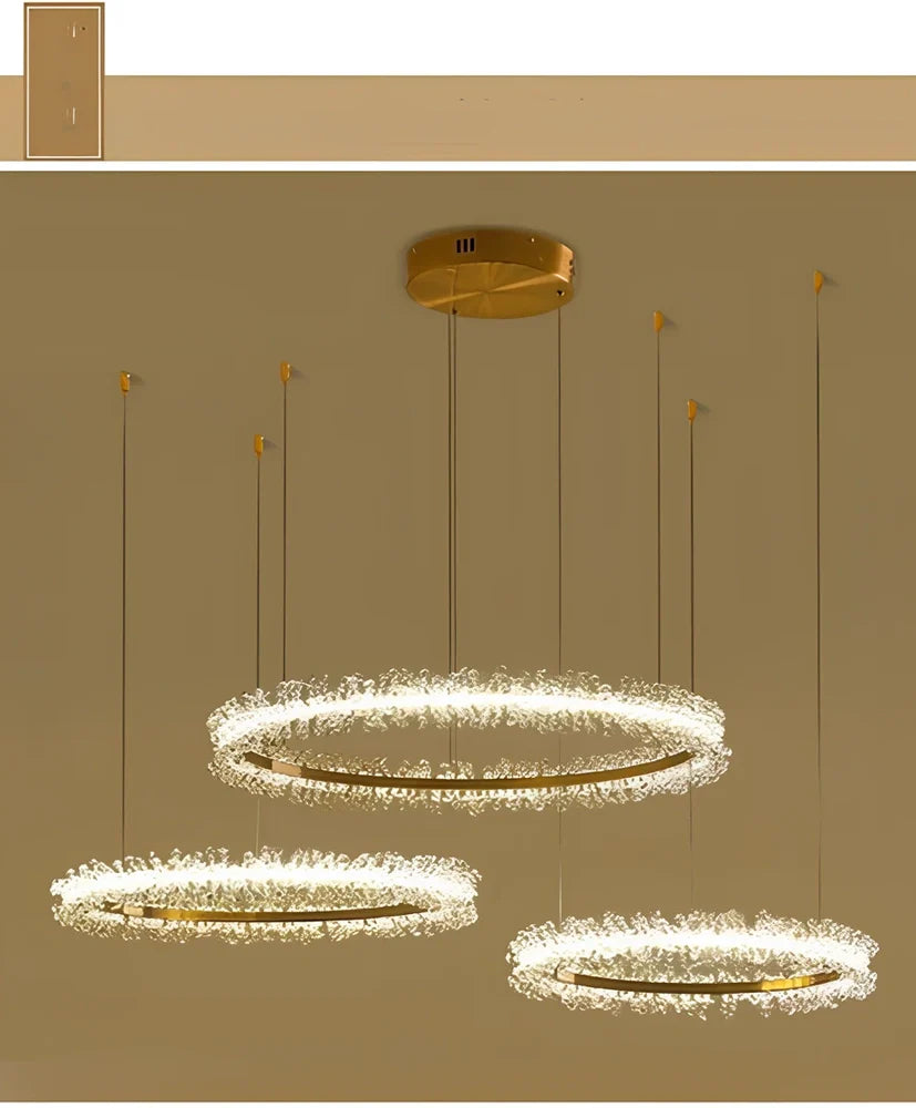 Gold electroplated crystal chandelier with remote control, adjustable height mechanism, and multiple LED lights