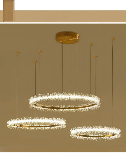 Gold electroplated crystal chandelier with remote control, adjustable height mechanism, and multiple LED lights