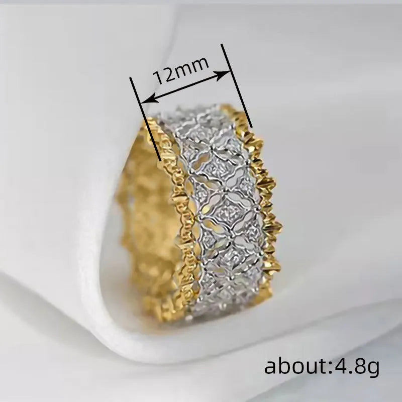 Geometric two-tone zircon ring with electroplated gold finish on copper, showing round elements and angular design