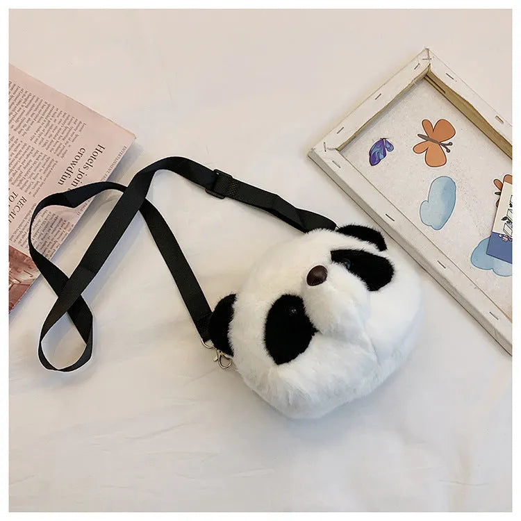Plush panda head crossbody bag with cylindrical shape measuring 18x15x8cm, showing sandwich pocket and soft texture