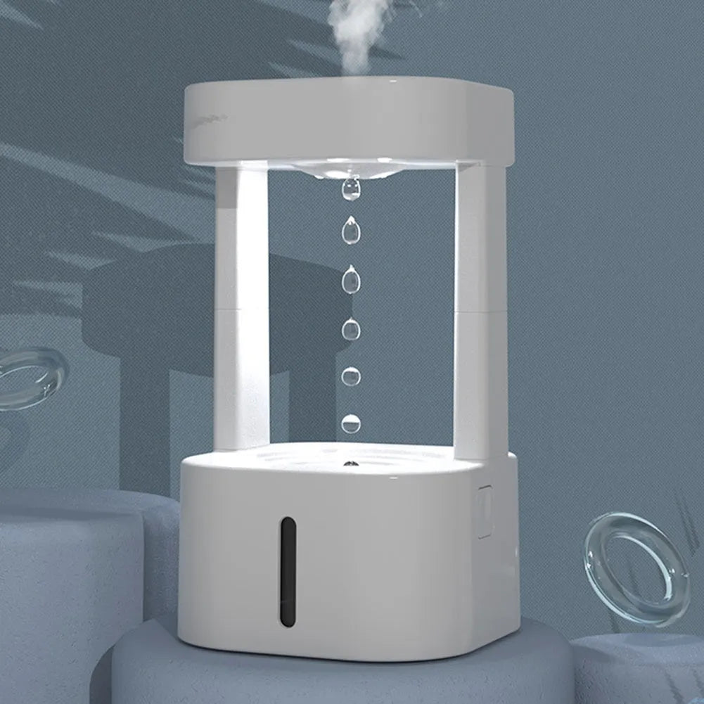 Creative anti-gravity water drop humidifier with upward flowing droplets and coloured lights