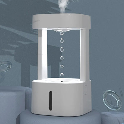 Creative anti-gravity water drop humidifier with upward flowing droplets and coloured lights
