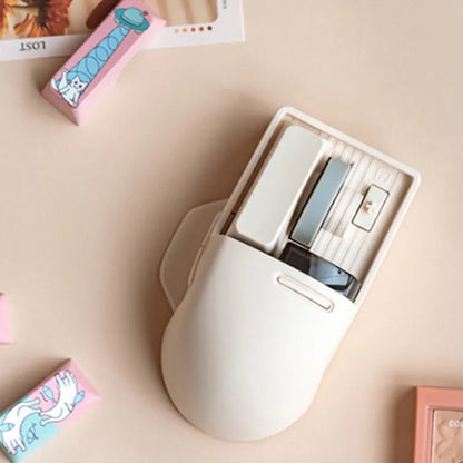 Xiaoqiao wireless mouse in tofu colour with ergonomic shape and four-way roller on desk