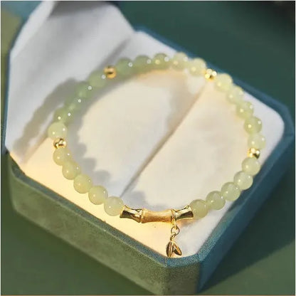 Retro bracelet with Ruyi flower design in glass and coloured glaze beads with electroplated accents