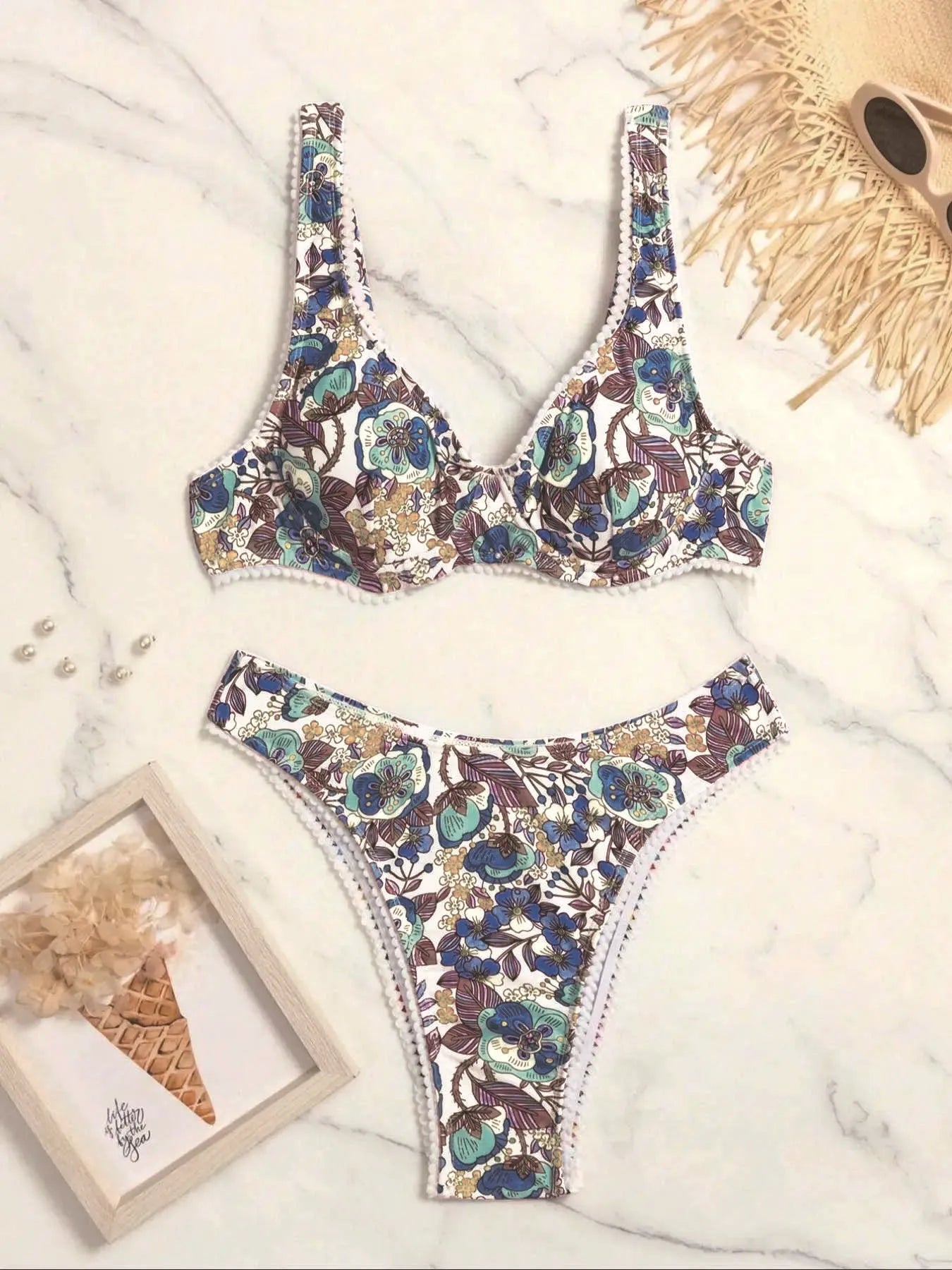 Women's floral print bikini with high waist briefs and adjustable ties.
