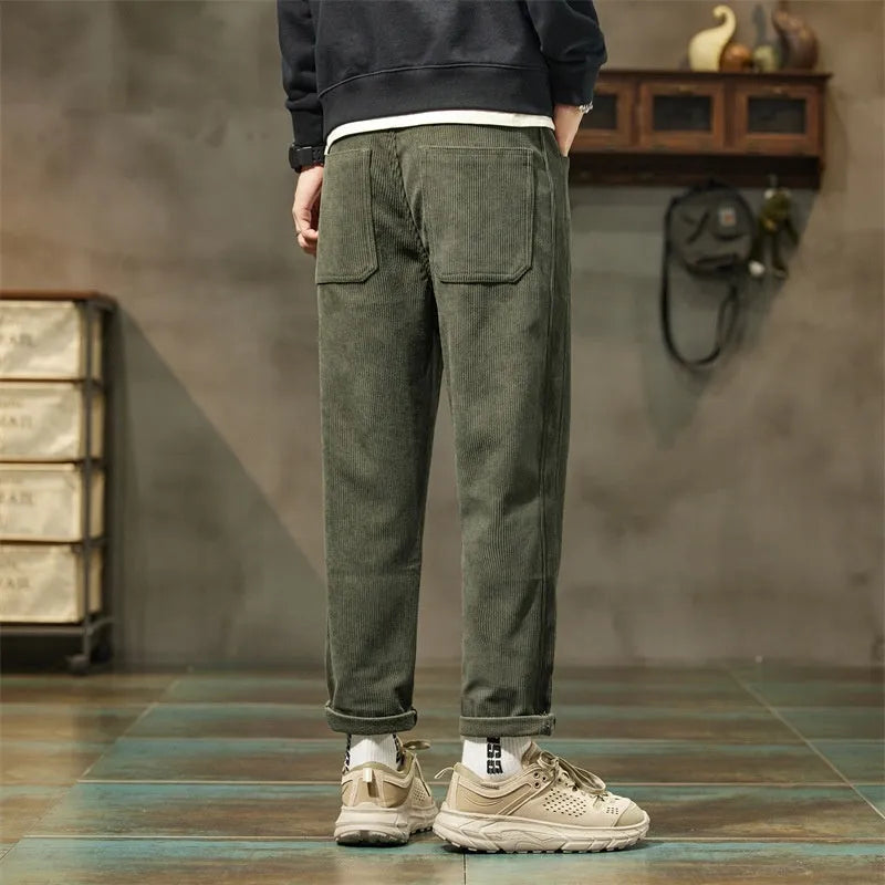 Corduroy men's casual pants with straight-leg tapered fit in mid waist for spring and autumn street fashion style, available in multiple colours including army green and black, sizes 28-38 with zipper fly closure
