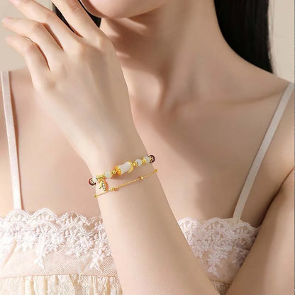 Retro bracelet with Ruyi flower design in glass and coloured glaze beads with electroplated accents