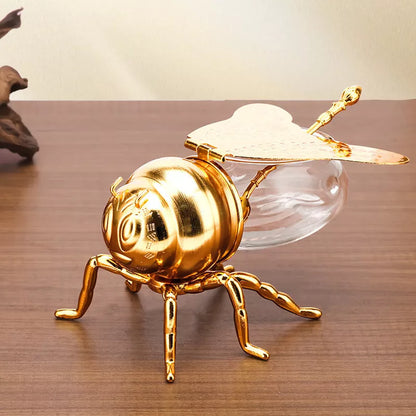 Bee-shaped honey jar with spoon, perfect for kitchen condiment storage