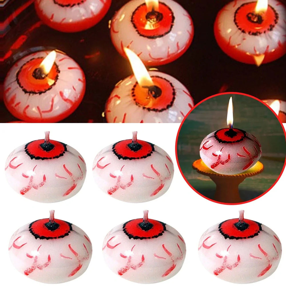 Red oval paraffin floating candle resembling eyeball in Halloween water display