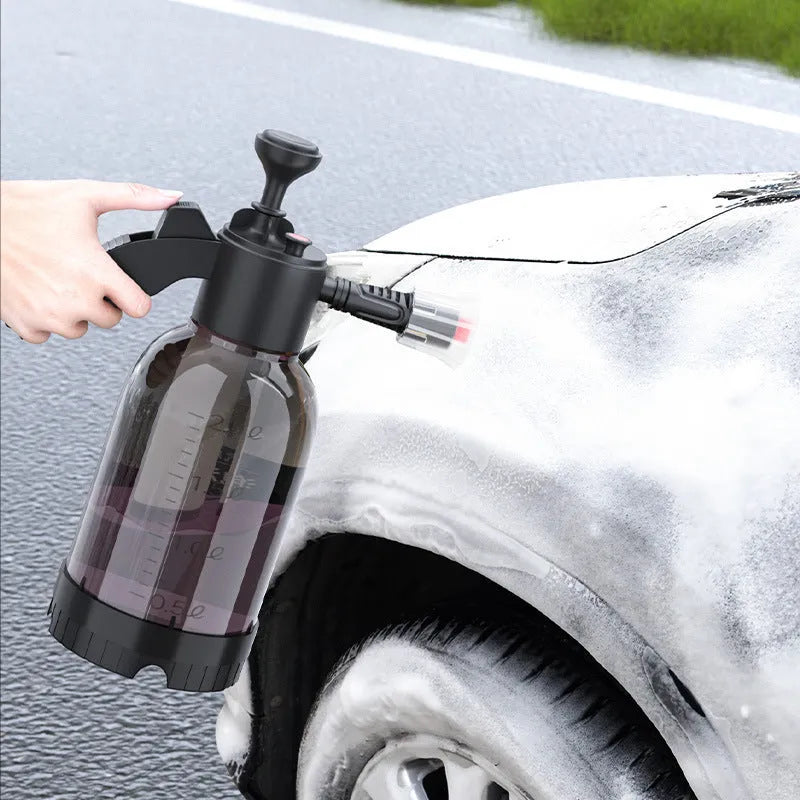 Black 2-litre hand-held foam sprayer with pump handle and two nozzles for car washing and gardening.