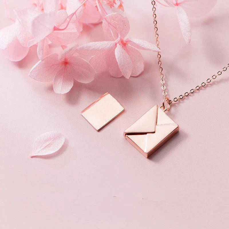 Stylish titanium steel envelope necklace with a discreet compartment for storing personal keepsakes