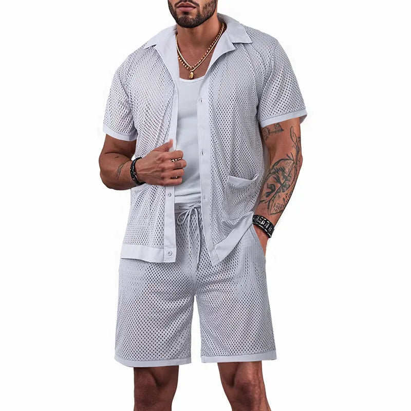 Women's lake blue see-through short sleeve cardigan and matching shorts beach cover-up set laid flat.