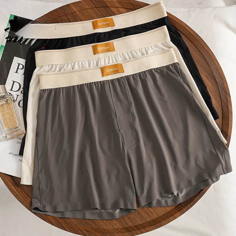 Men's loose-fit Ice Silk nylon underwear in a three-pack, showing colour options like black, green, and grey.