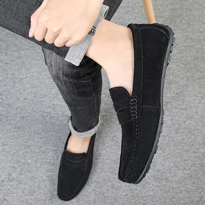 Men's suede loafers in black, blue, dark blue, wine red, and yellow colours with round toe and slip-on design.