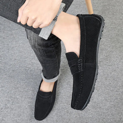 Men's suede loafers in black, blue, dark blue, wine red, and yellow colours with round toe and slip-on design.