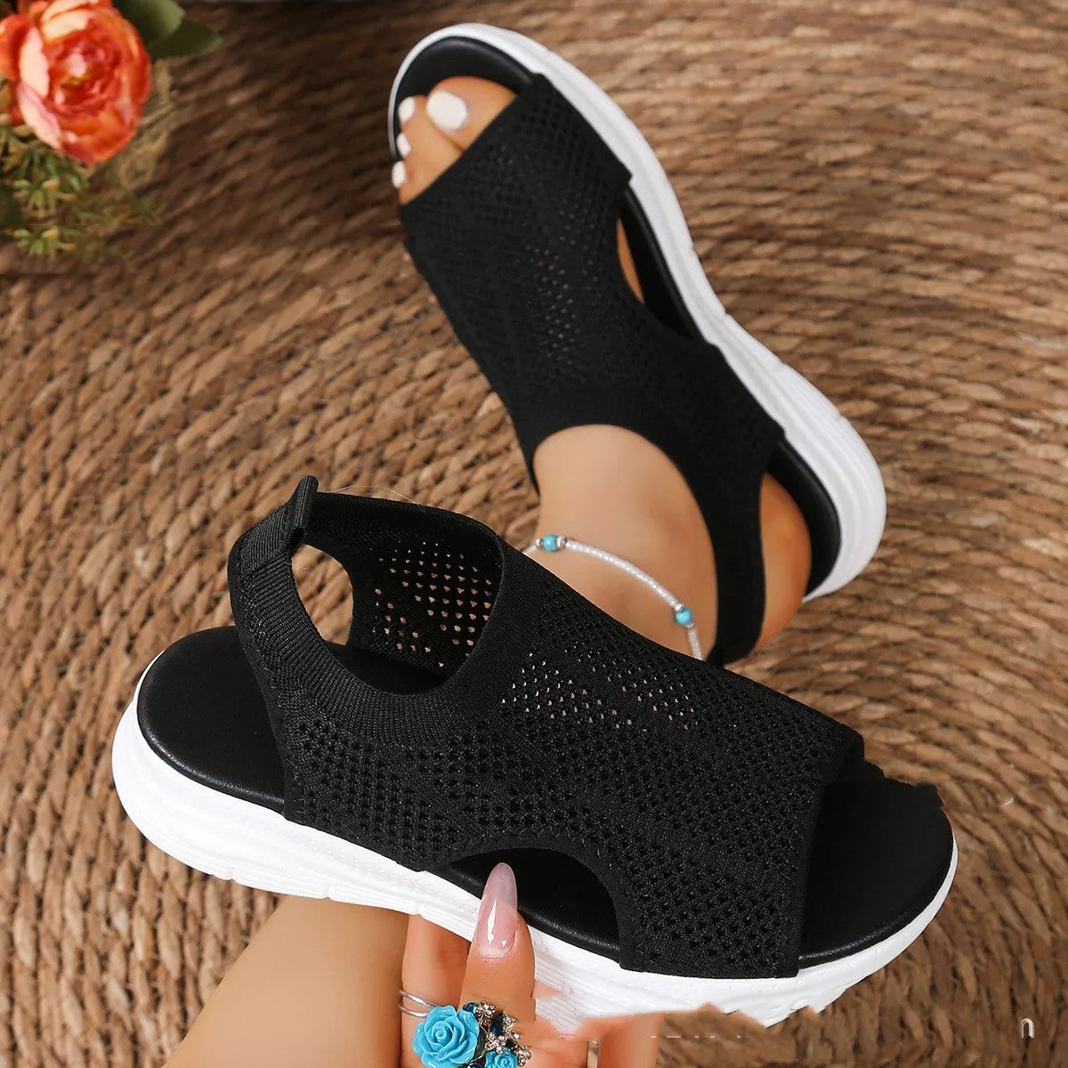Women's platform sports sandals in black with mesh lining and a flat toe rubber sole.