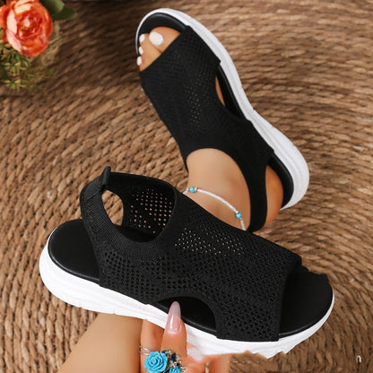 Women's platform sports sandals in black with mesh lining and a flat toe rubber sole.