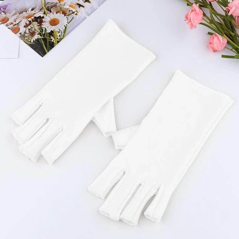 Manicure gloves with UV protection, featuring a stylish half-finger design and hand-painted finish for a comfortable and functional at-home nail care experience.