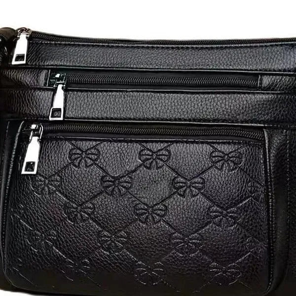 Butterfly black women's crossbody bag with horizontal square shape and embossed pattern
