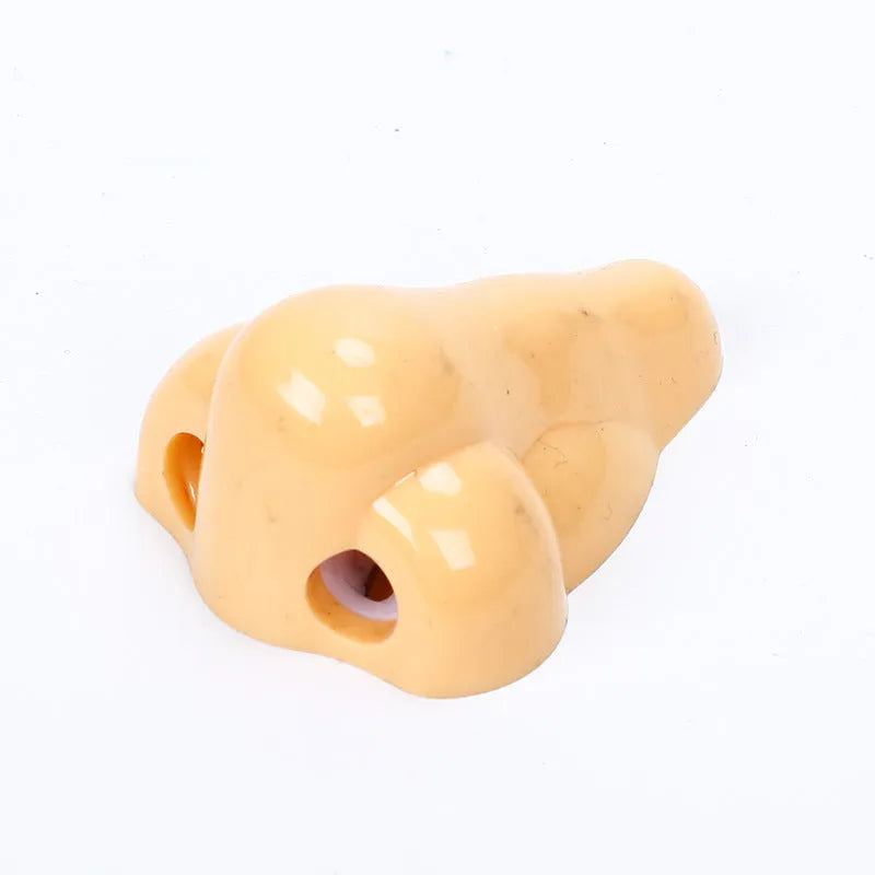 Geometry-shaped plastic pencil sharpener measuring 58x45x30mm in flesh colour