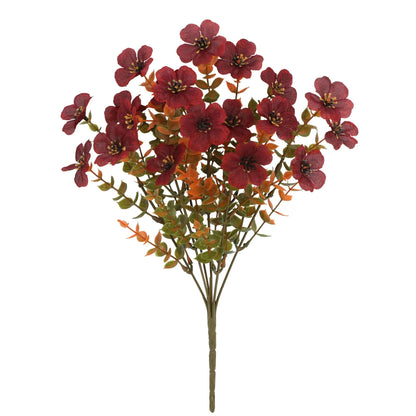 Autumn coloured artificial flower bouquet with plastic and silk flowers for decoration.