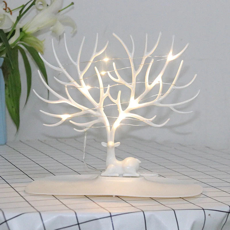 Deer Antler Jewelry Stand in white and black, organizing earrings, necklaces, and bracelets