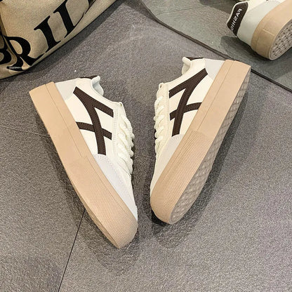 Blue and brown low-top casual sports shoes with round toe and flat rubber sole.