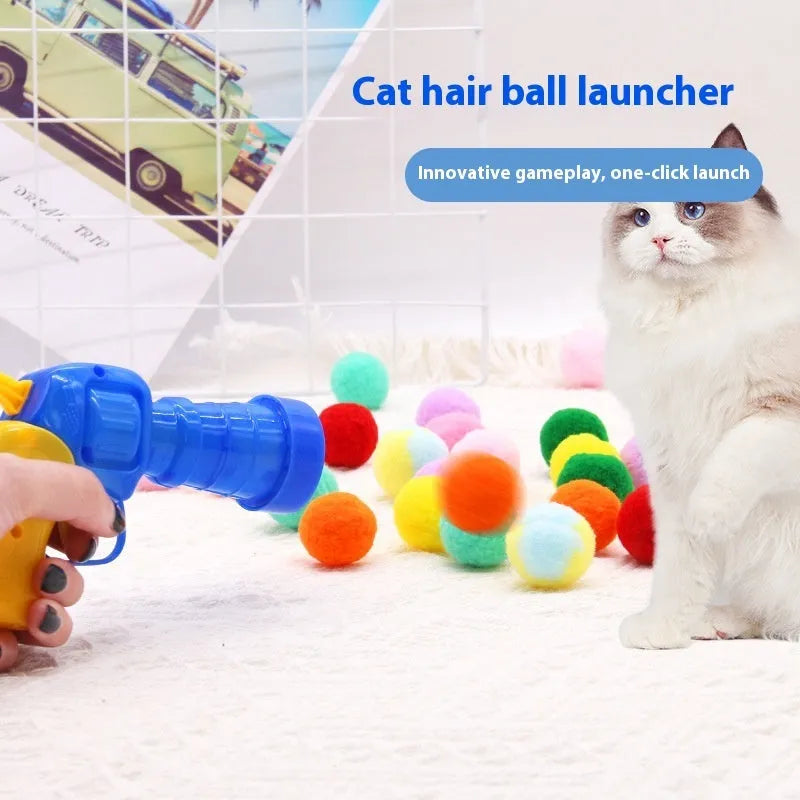 Interactive plastic pet toy gun and soft plush yarn balls on a carpet for fetch games.
