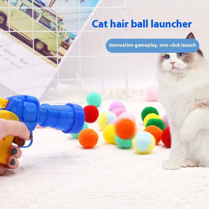 Interactive plastic pet toy gun and soft plush yarn balls on a carpet for fetch games.