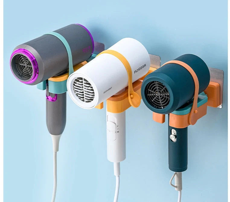 Adjustable wall-mounted hair dryer rack in orange, pink, and green