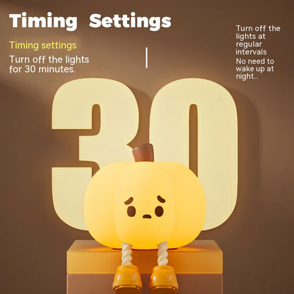Orange silicone pumpkin night lamp measuring 98x105x83mm with built-in battery and USB charging port