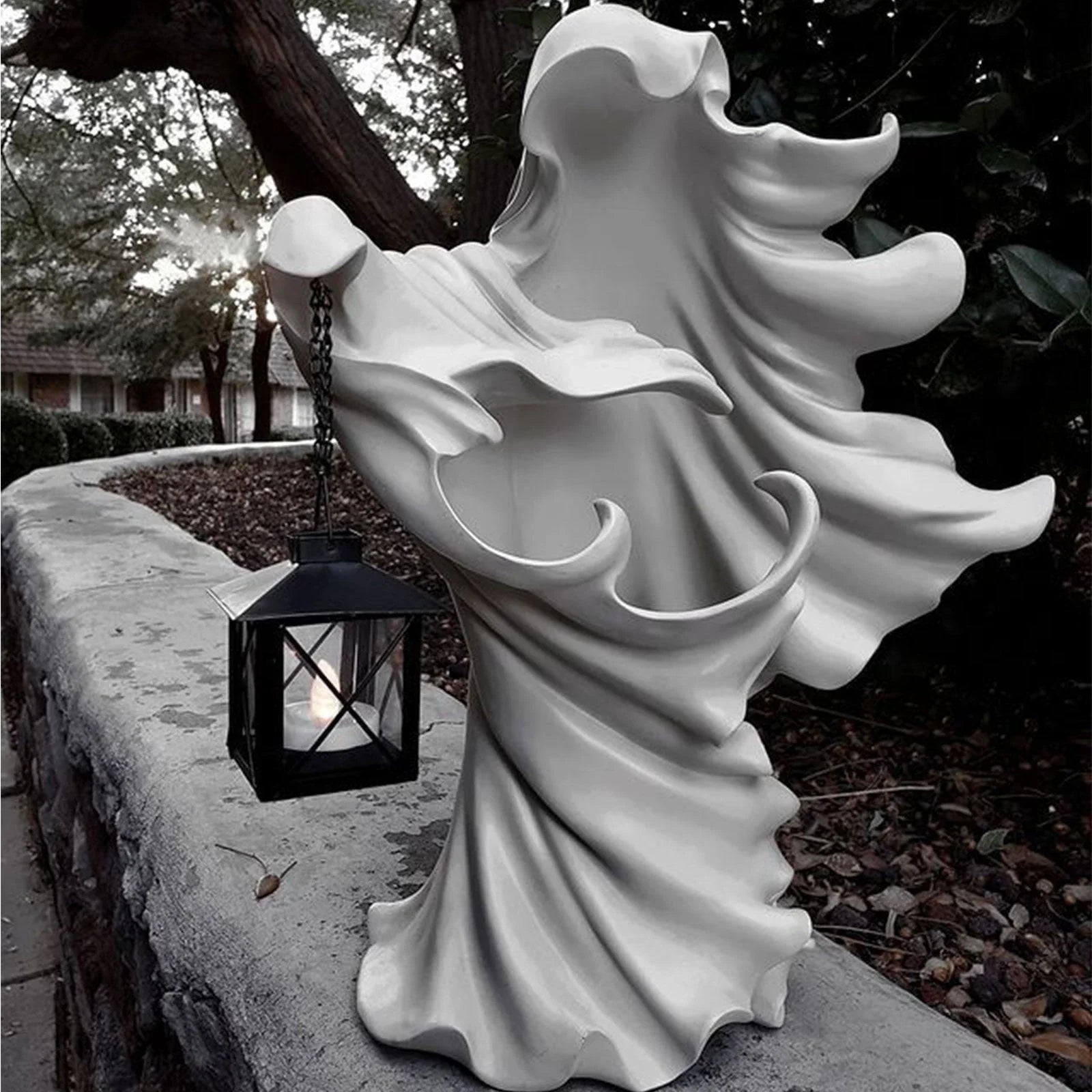 Faceless ghost sculpture in resin, a unique Halloween decoration with a spooky, supernatural design