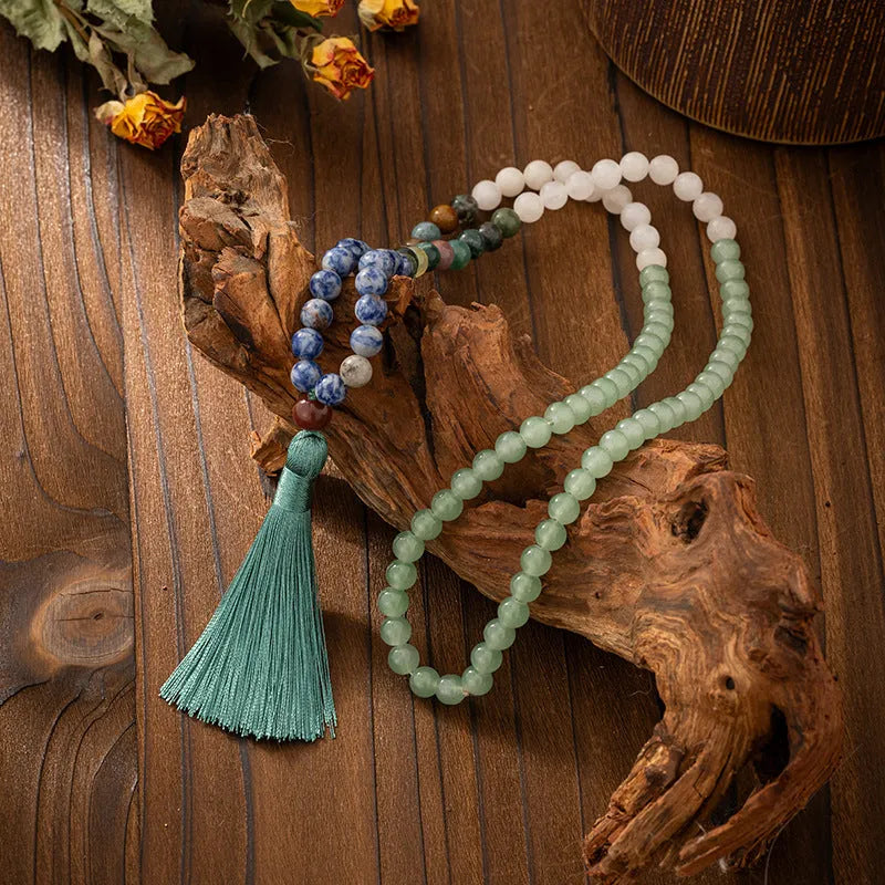 Vintage bohemian-style long beaded sweater chain with a tassel, showing necklace and bracelet lengths.