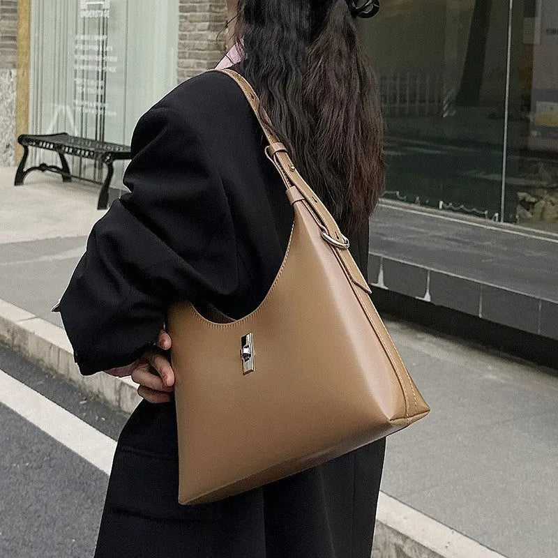 Genuine leather dumpling-shaped crossbody shoulder bag in six colour options showing sandwich pocket and internal organisation