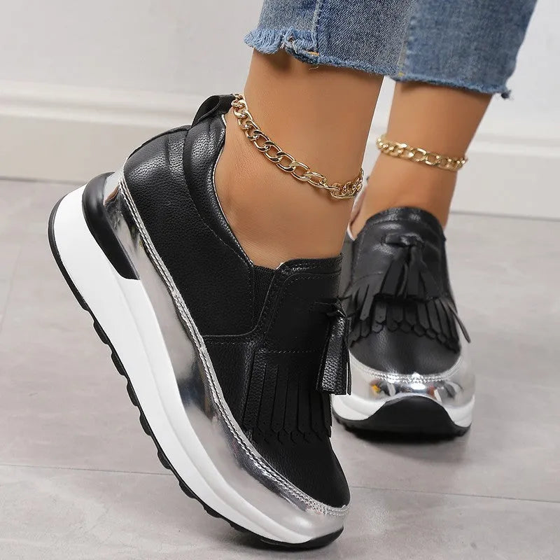 Women's black platform casual shoes with tassel detail and muffin wedge heel