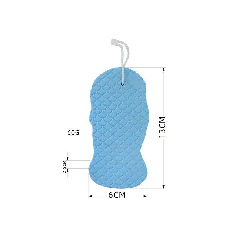White 3D bath ball sponge with a fish scale exfoliating texture on a blue background.