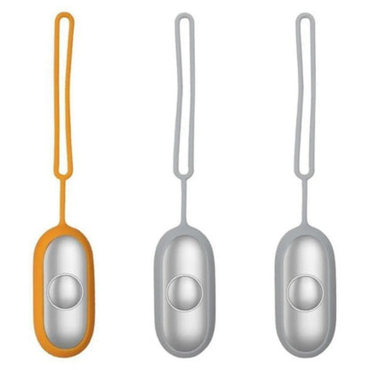 Hand-held micro-current sleep aid device in grey, green, and orange colour options