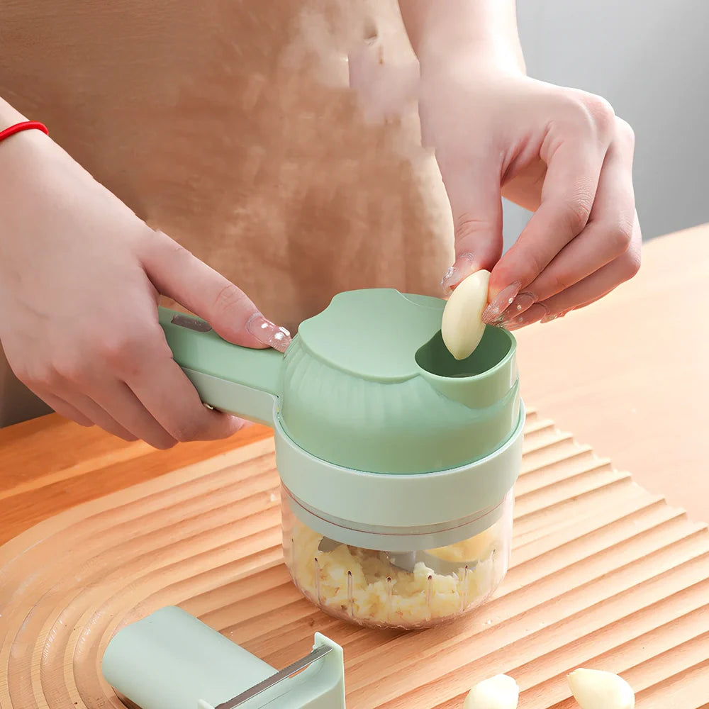 Green wireless vegetable cutter with stainless steel blade and transparent container for food processing