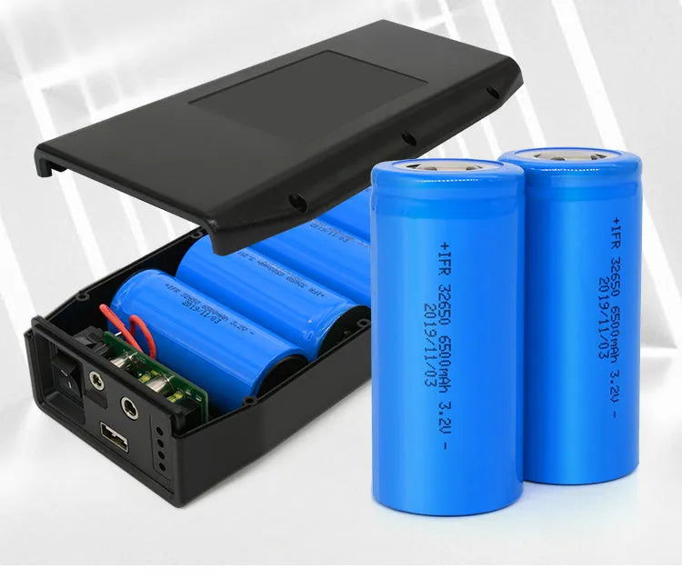 LF4100 compact black 12V lithium iron phosphate battery with output ports and included charger.