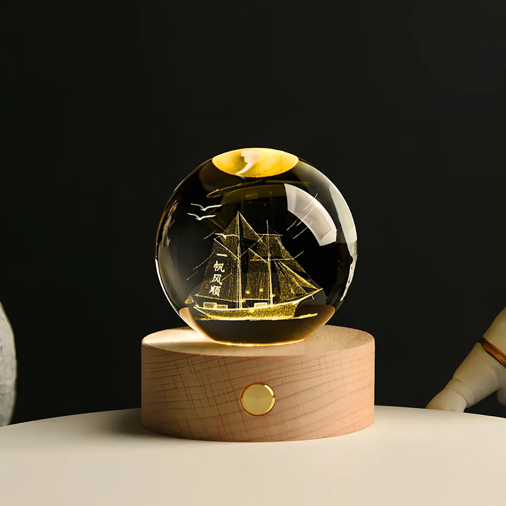 Transparent crystal ball with 3D laser inner carving of galaxy patterns on charging base