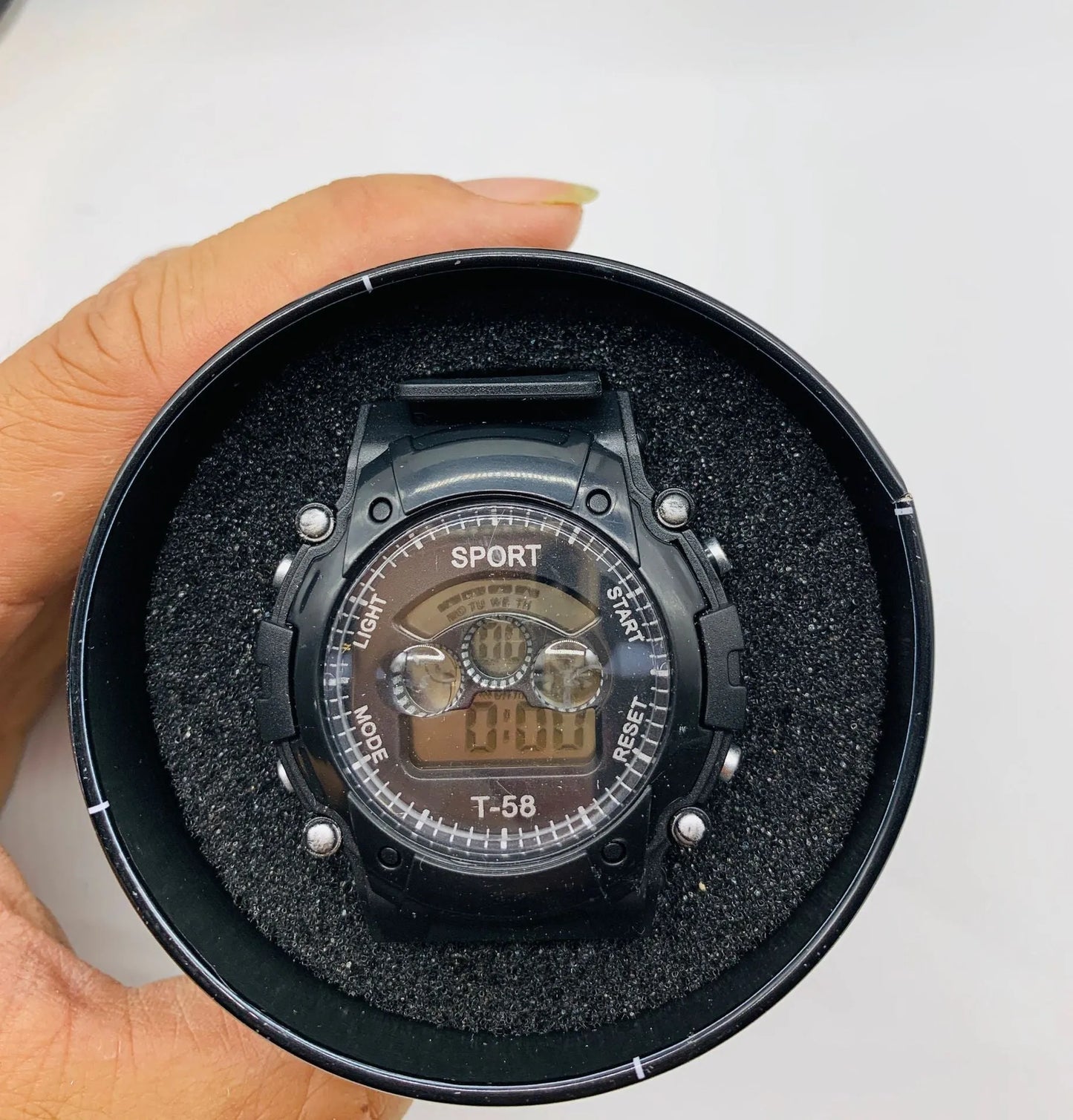 Digital sports watch for children with silicone strap, plastic case, and mixed colour display