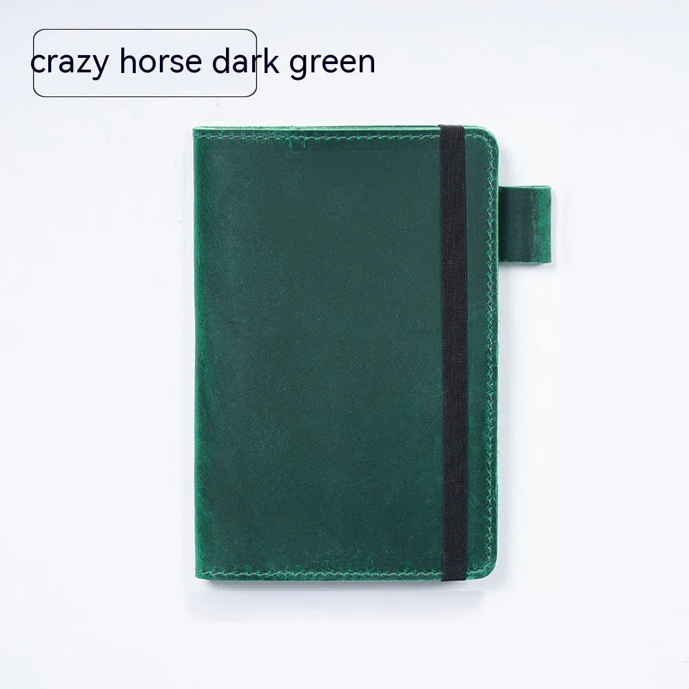 Handmade cowhide kraft notebook open showing wood-free paper, in dark green colour