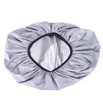 Waterproof backpack cover in various colors, showing elastic edge and compact fold