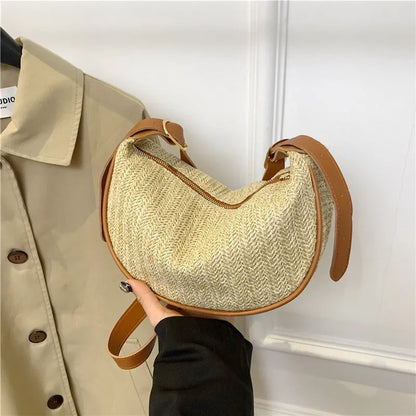 Women's woven straw crossbody bag with internal phone and file pockets in various colours.