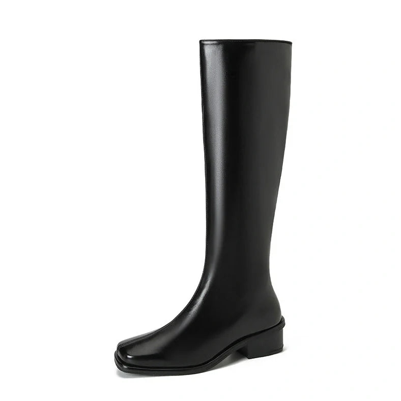 Black square toe over-the-knee boots with 4cm chunky heel showing leather interior and rubber sole