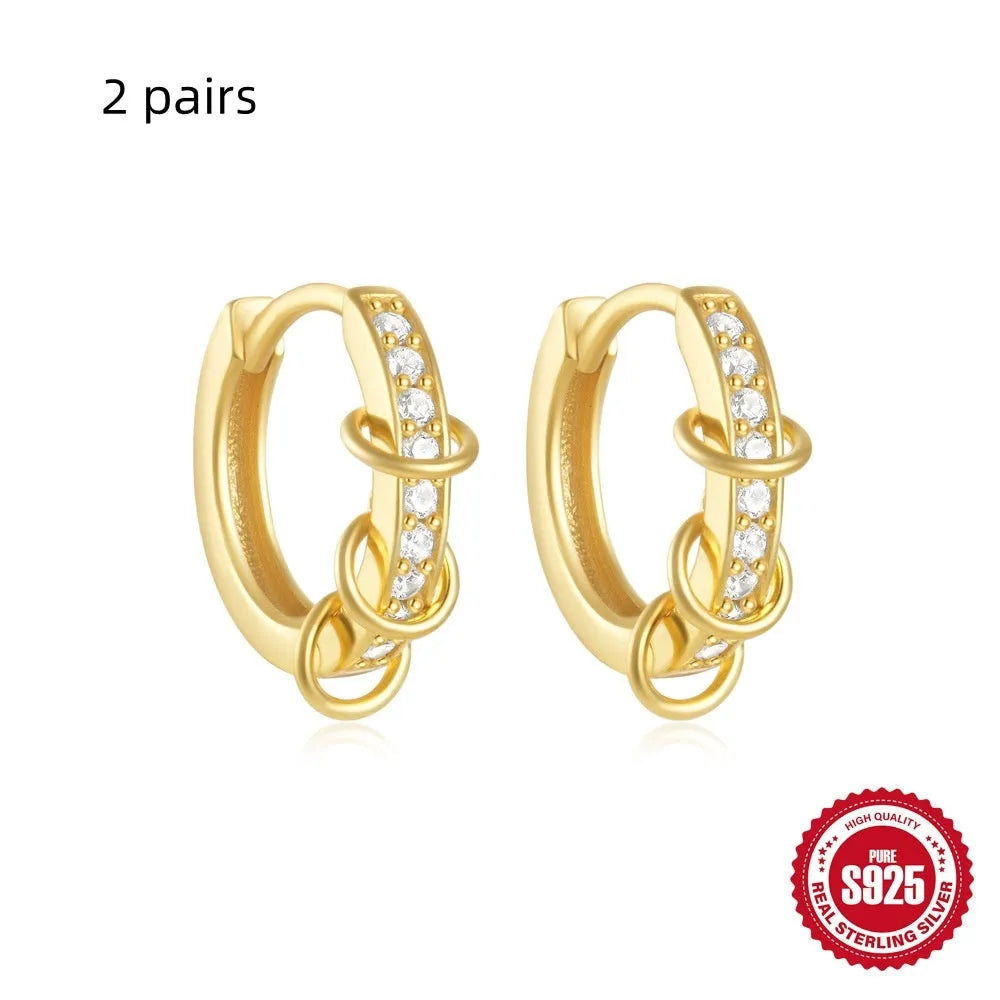 Sterling silver geometric stud earrings with small round diamond accents in gold or silver finish