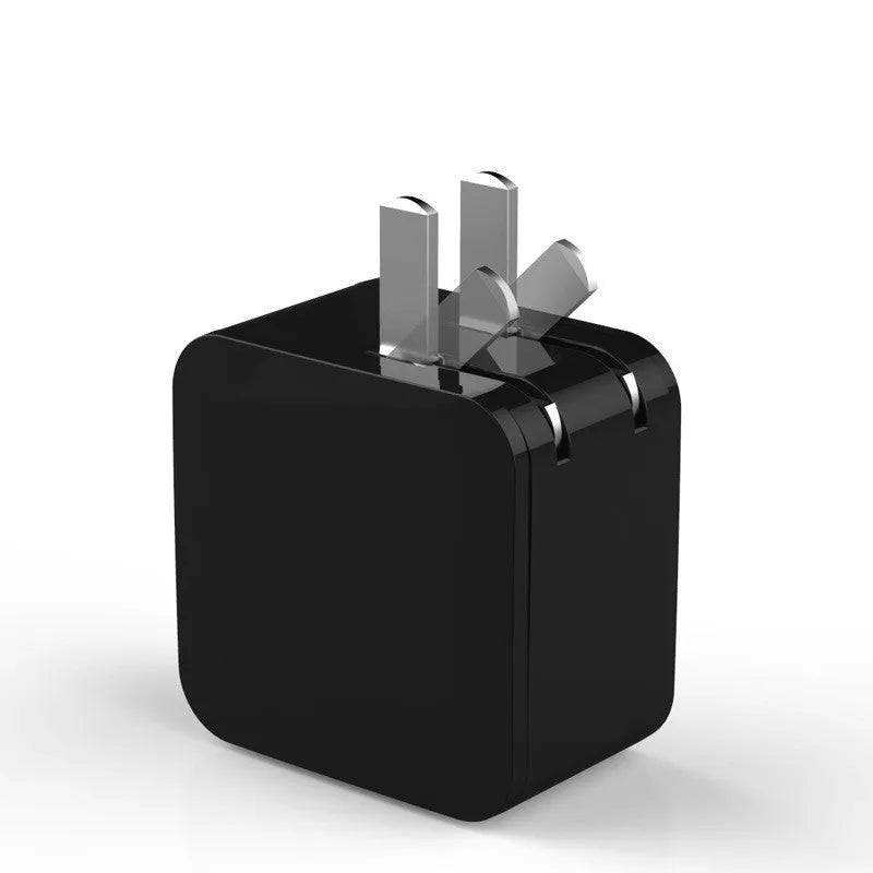 Black dual USB fast charger with digital voltage display showing 5V output and foldable UK plug
